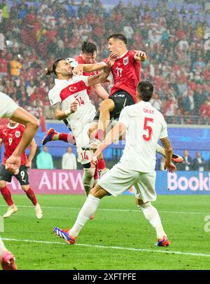 Christoph Baumgartner, AUT 19 Michael Gregoritsch, AUT 11  compete for the ball, tackling, duel, header, zweikampf, action, fight against Abduelkerim Bardakci, Tuerkije 14  in the best of 16 match AUSTRIA  - TueRKIJE 1-2 of the UEFA European Championships 2024  on Jul 02, 2024  in Leipzig, Germany.  Photographer: ddp images / star-images Stock Photo