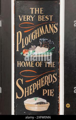 England, Kent, Canterbury, Pub Sign Artwork Advertising Ploughmans Lunch and Shepherds Pie Stock Photo