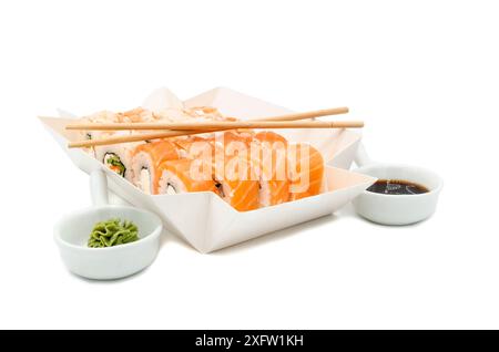 Sushi box, on a white isolated background. Sushi menu in a white transport box. Stock Photo
