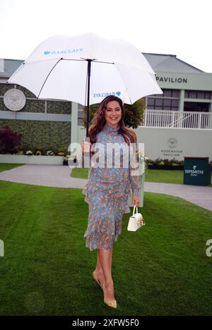 Kelly Brook with a Barclays umbrella at the Rosewater Pavilion as she