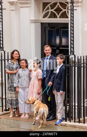 Outgoing Conservative chancellor of the exchequer Jeremy Hunt, with his ...