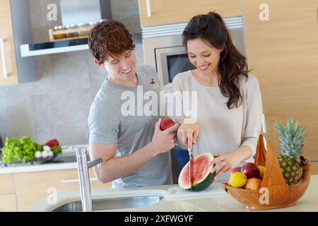 Young couple in kitchen Stock Photo