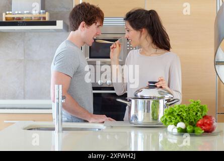 Young couple in kitchen Stock Photo