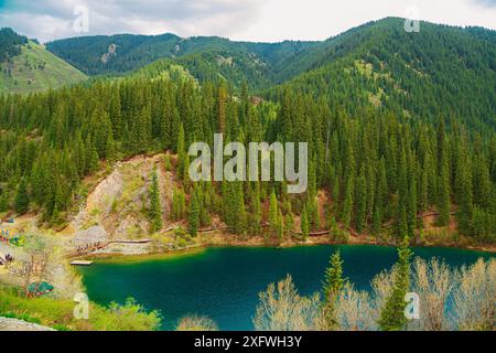 Alpine lake Kolsai in Kazakhstan. Beautiful mountain natural landscape. Nature reserve. View from above. Stock Photo