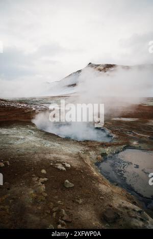 Smoke emitting from geyser against sky Stock Photo