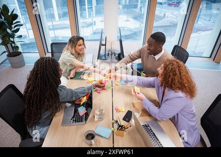 High angle view of diverse team brainstorming for ideas in office Stock Photo