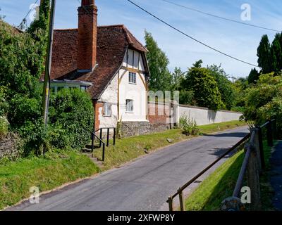 Rural house on a village road viewed from the pavement in East Hendred, Wantage, Oxfordshire, England Stock Photo