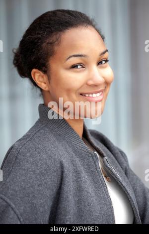 Portrait of smiling young woman in casual Stock Photo