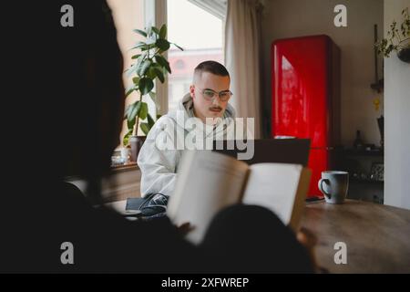 Young male entrepreneur working from home Stock Photo