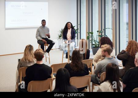 Multiracial colleagues discussing ideas during meeting in office Stock Photo