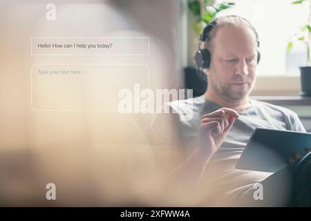 Mature man taking assistance of AI at home Stock Photo