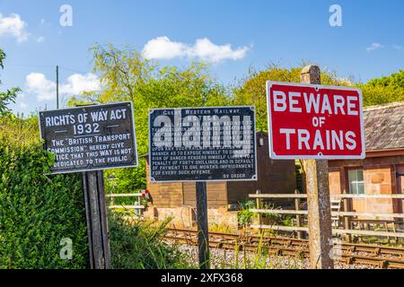 A collection of historic cast iron railway signs at the West Somerset Railway, Williton station, England, UK Stock Photo