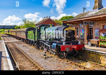 Preserved ex-GWR steam loco 7828 'Odney Manor' arriving at Williton station on the West Somerset Railway Steam Gala, England, UK Stock Photo