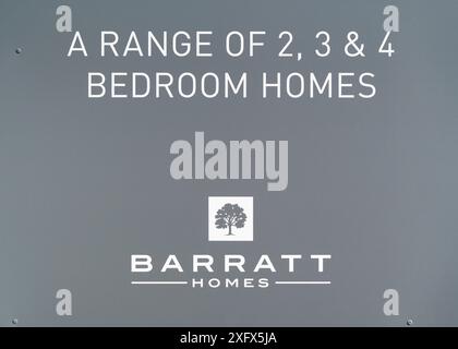 Close up of Barratt Homes sign board advertising a range of new build 2, 3 & 4 bedroom homes on a new housing development site in the Midlands, UK. Stock Photo