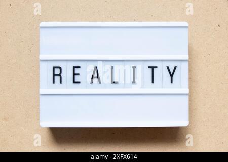 Lightbox with word reality on wood background Stock Photo