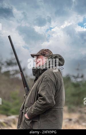 older white man with shotgun Stock Photo