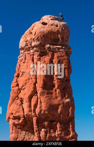 Climber on top of Owl Rock, Garden of Eden, Arches National Park, Colorado Plateau, Moab, Utah, USA. October 2016. Stock Photo