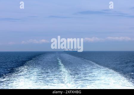 Water trail behind cruise ship. Summer travel concept. High quality photo Stock Photo