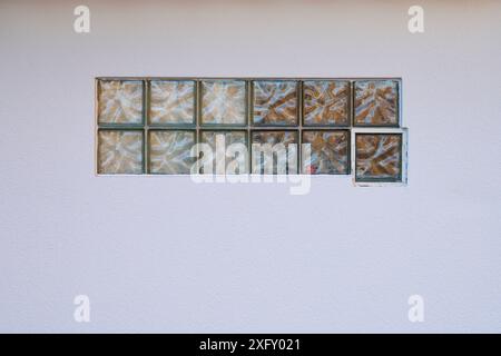 Glass blocks in white wall, Germany, Europe Stock Photo