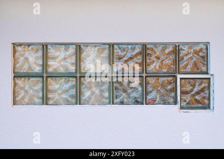 Glass blocks in white wall, Germany, Europe Stock Photo