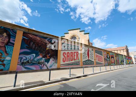 Barcelona, SPAIN - JULY 5, 2024: Murals on the exterior of Barcelona's model prison wall, showing artistic talent against time-worn architecture. Stock Photo