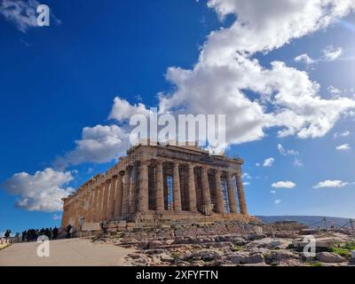 View of the Acropolis in Athens. Rising 490 ft above Athens lie the ruins of the citadel of Acropolis. The site spreads over 7.3 acres and dates back to the Middle Neolithic era (10,000 BCE). Several monumental spaces such as the Parthenon, Old Temple of Athena, Erechtheum, Temple of Athena Nike, Theatre of Dionysus Eleuthereus, and others can be found in the ruins. Most of the major temples, including the Parthenon, were rebuilt by order of Pericles during the so-called Golden Age of Athens (460–430 BC). Phidias, an Athenian sculptor, and Ictinus and Callicrates, two famous architects, were r Stock Photo