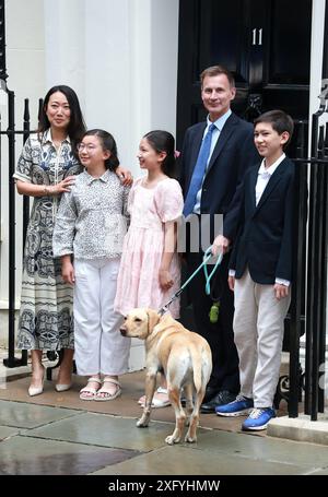 Outgoing Conservative chancellor of the exchequer Jeremy Hunt, with his ...