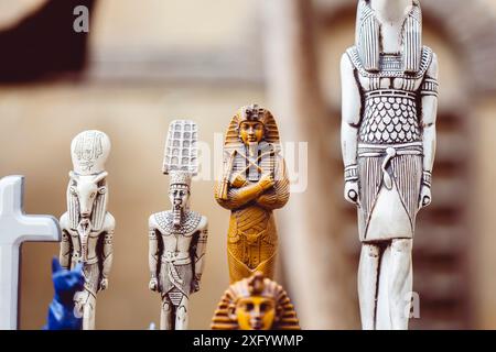 Statues of ancient Egyptian pharaohs and gods. Various hieroglyphs on ...