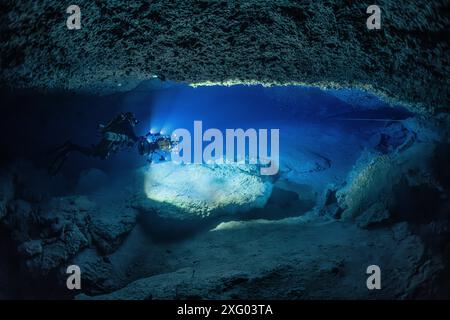 Tek (Trimix) speleologist diver in a karstic underwater cave over 70 meters deep, Photogrammetry, twiglight zone, Mayotte Stock Photo