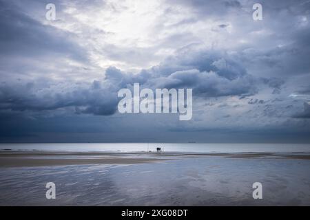 Fishermen on the beach at Sangatte before the storm, Cote d'Opale, Pas-de-Calais, France Stock Photo