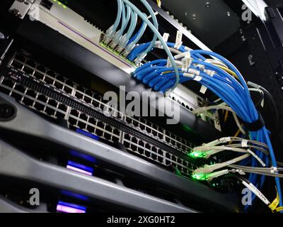 Man fixing server in data center room . Stock Photo