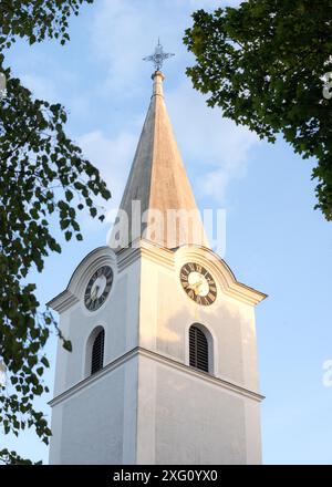 White belltower of a church in Burgenland Stock Photo