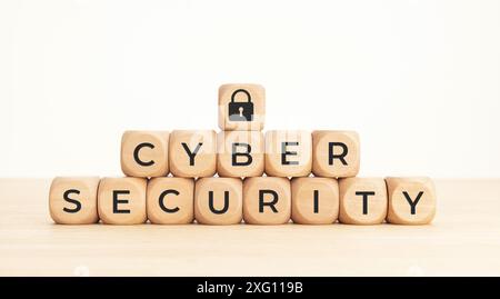 Cybersecurity data protection concept. Text and lock pad icon on wooden blocks Stock Photo