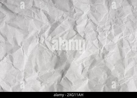 Creased paper background texture. Gray color. Full frame Stock Photo