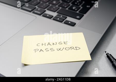 Change password message on sticky note on laptop. Computer security management concept Stock Photo