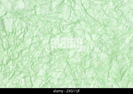 Crumpled paper abstract background texture. Green color. Full frame Stock Photo