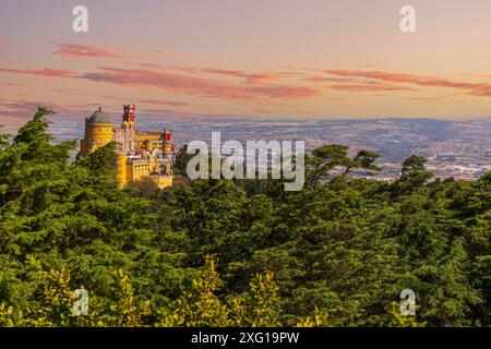 Panoramic View Of Pena Palace, Sintra, Portugal. Pena National Palace at dusk Stock Photo