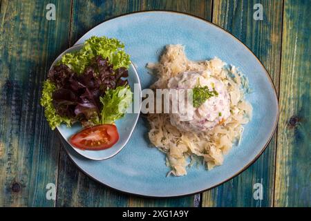 Bacon dumplings on sauerkraut Stock Photo