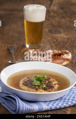 Austrian cheese dumpling soup on wood Stock Photo