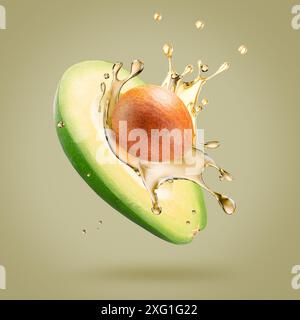 avocado with oil splash on a light green background. Stock Photo