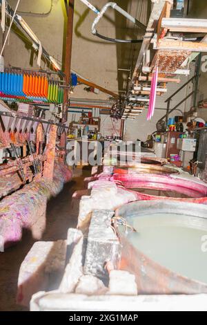 drums of molten wax in artisan factory Stock Photo