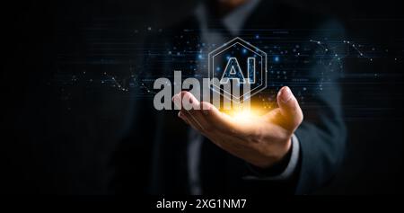 Businessman holding AI hologram, representing artificial intelligence and innovation. Ideal for tech companies, futuristic concepts, data networks Stock Photo