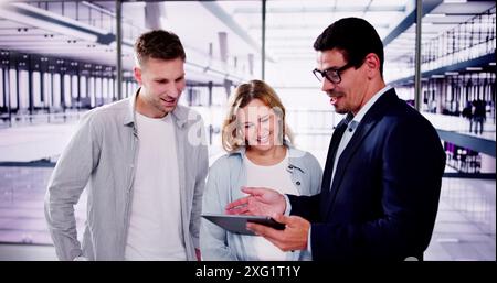 Married couple consulting with real estate agent about future investment opportunities in a commercial property partnership agreement. Stock Photo