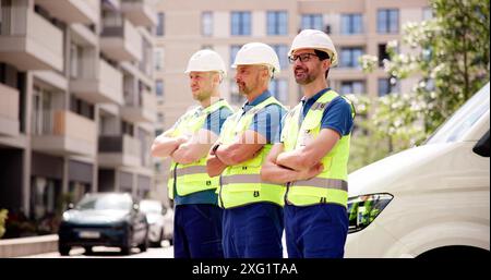 Building Together: Smiling Construction Manager Leads Happy Team in Development Project on Construction Site portrait, leadership, architecture, teamw Stock Photo