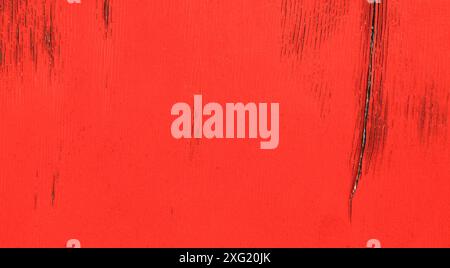 Red wall, texture, background. The wooden wall, painted with enamel paint. Flat surface in reddish color. Old painted surface with many cracks Stock Photo