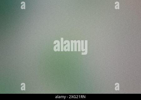 Abstract background featuring a smooth blend of green and grey with a subtle grainy texture Stock Photo