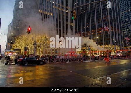 Giant red Christmas balls on 6th Avenue (Avenue of the Americas, Manhattan, New York City), with holiday decorations during the christmas season Stock Photo