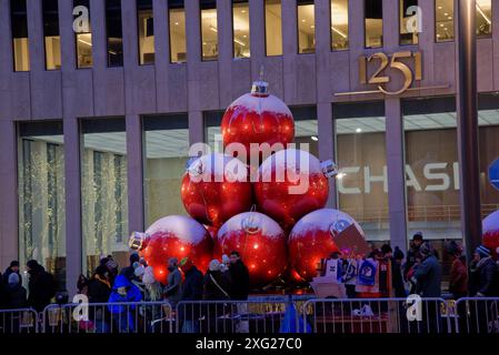 Giant red Christmas balls on 6th Avenue (Avenue of the Americas, Manhattan, New York City), with holiday decorations during the christmas season Stock Photo