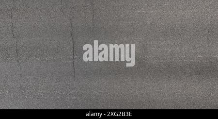 view from above on texture of asphalt road with cracks Stock Photo