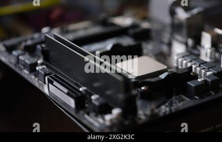 Tiny silver detail in computer processor, computer motherboard with all component Stock Photo